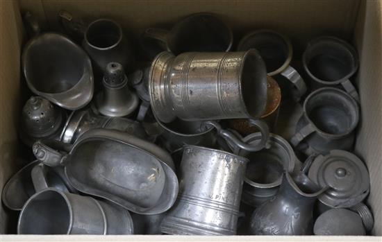 A collection of 18th and 19th century pewter mugs, cream jugs, etc.